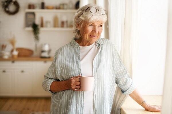 portrait-stylish-gray-haired-woman-with-round-spectacles-her-head-enjoying-morning-coffee-m