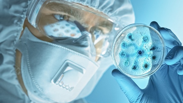 Scientist-bacteria-petri-dish-scaled